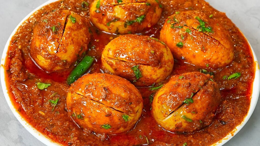 "Dhaba-style egg curry garnished with fresh coriander leaves"